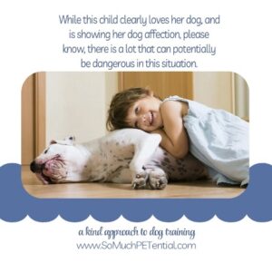 a child lying on the family dog has potential dangers